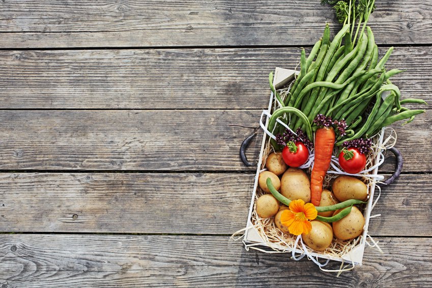 Fresh vegetables in a box, a face